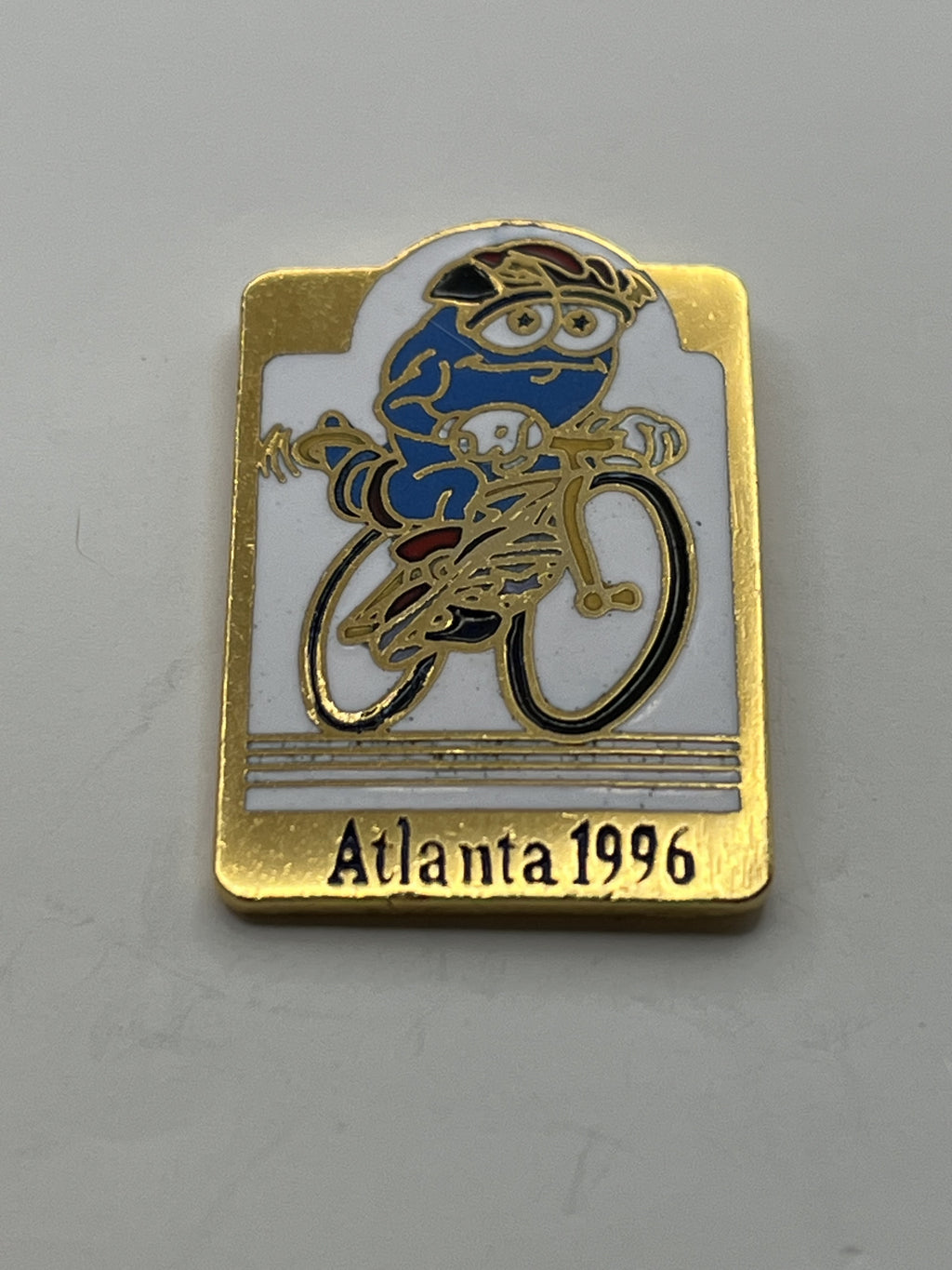 1996 Atlanta Olympic Cycling Pin ~ Izzy Mascot on Bike