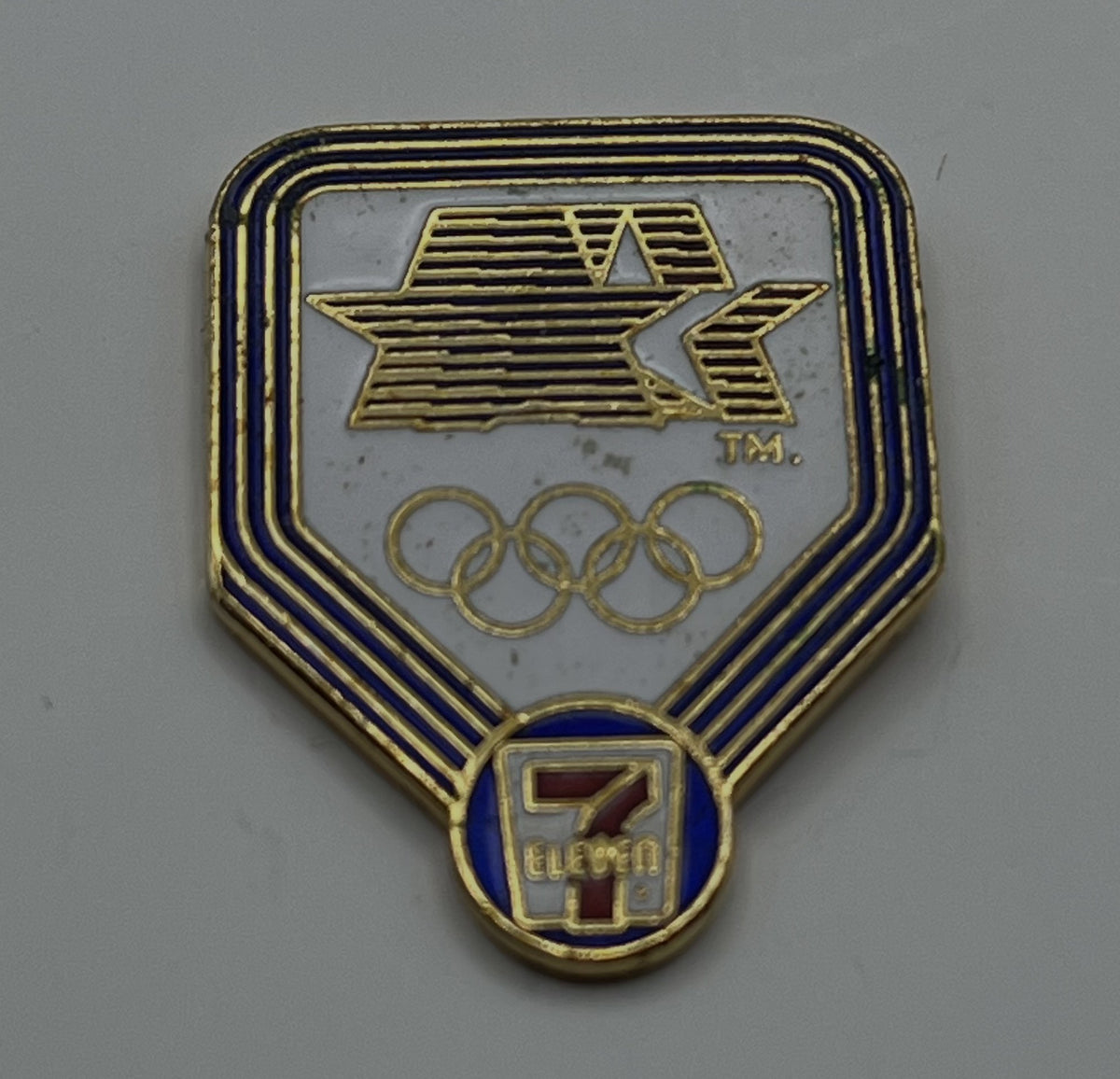 1984 Olympic Pin ~ Sponsor ~ 7-Eleven ~ 84' Stars in Motion Logo