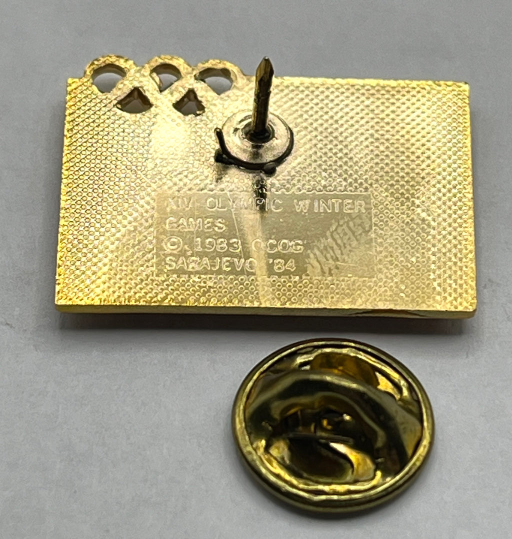 1984 Sarajevo Winter Olympics Pin ~ Robert Landau Associates, Inc. ~ RLA ~ Snowflake Emblem