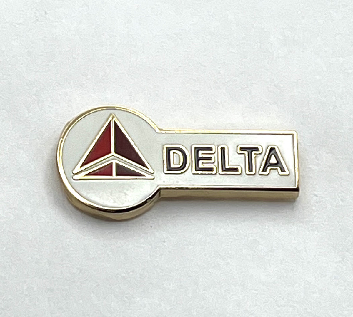 Delta Air Lines widget key-style lapel pin — modern cloisonné reproduction.