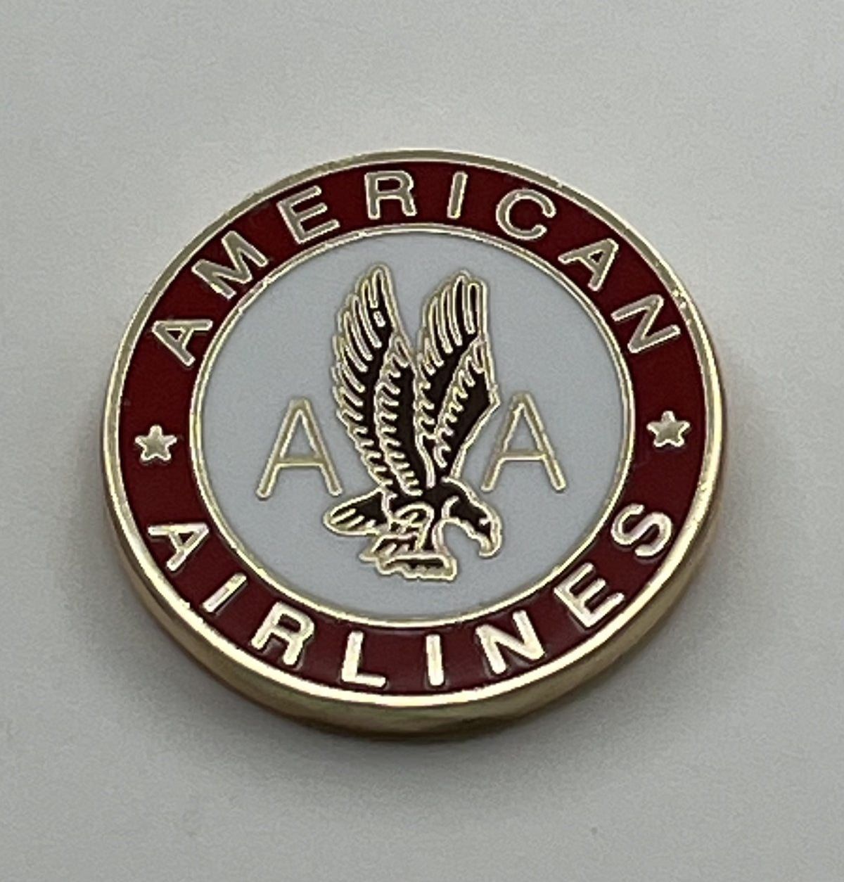 American Airlines eagle seal round lapel pin — modern cloisonné reproduction.