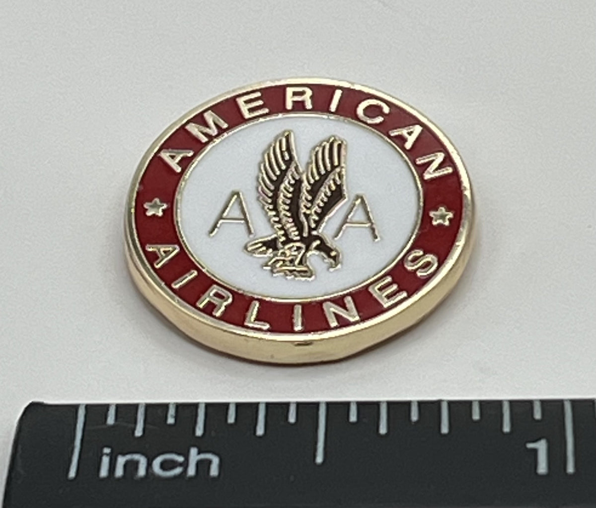 American Airlines eagle seal round lapel pin — modern cloisonné reproduction.