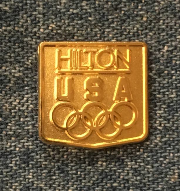 Hilton gold tone 1984 Los Angeles Olympic sponsor lapel pin